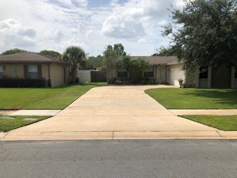Clean concrete driveway after pressure washing in Kissimmee, FL